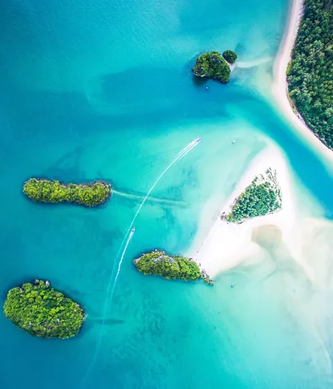 Small green islands in a turquoise lagoon
